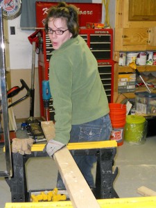 Girl posing using power tools