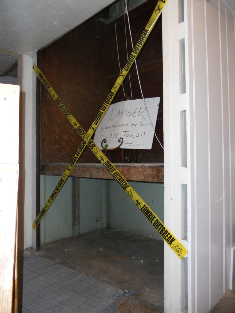 old elevator with Caution Tape